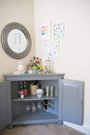 Tour A D C Designer S Colorful Contemporary Apartment The Everygirl Living Room Cabinets Small Corner Cabinet Corner Bar Cabinet