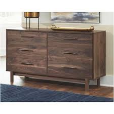 The finish over replicated oak grain easily complements other furniture finishes. B201 31 Ashley Furniture Matrix Bedroom Dresser