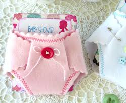 String miniature diapers together to create a cute baby shower or gender reveal party banner. Baby Shower Diaper Invitations