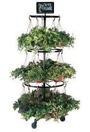 This is a three tier wire mesh gold hanging basket. 3 Tier Hanging Basket Stand Hanging Basket Garden Hanging Basket Stand Garden Center Displays