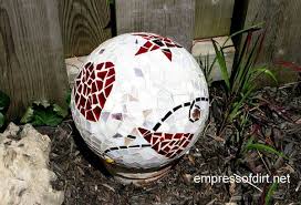 Mosaic artist karen silton instructing how to mix thinset and attach mirror and china plate pieces to a garden gazing ball. Garden Art Ball Idea Gallery Empress Of Dirt