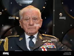 In this Wednesday, Nov. 11, 2015 photo, Jack Weimer pulls a part from a  junk motorcycle at Aadlen Brothers Auto Wrecking, also known as U Pick  Parts, in the Sun Valley section