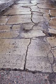 There are several potholes and dents in it. How To Repair Asphalt Driveway Cracks Howstuffworks
