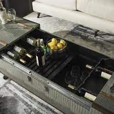 Check out our wine barrel coffee table selection for the very best in unique or custom, handmade pieces from our coffee & end tables shops. Safavieh Zoe 100 0 Pound S Gray Wheeled Wood Storage Trunk Lowes Com Wine Rack Storage Coffee Table With Storage Coffee Table Trunk