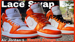 Following we have white on the tongue label and across the midsole while black covers the outsole to complete the look. Lace Swap Jordan 1 Mid Electro Orange On Feet Youtube