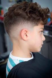 A medium fade that is up and over the ears, but not quite past the temples is a great way to showcase slightly longer hair that is really curly. 35 Little Boy Haircuts Your Kid Will Love Menshaircuts Com