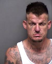 MUGSHOT: Matthew Holman, 37, was arrested after he was accused of kicking  in his ex-girlfriend's door, pointing a gun at her, and threatening her by  saying "you're gonna pay for this," say