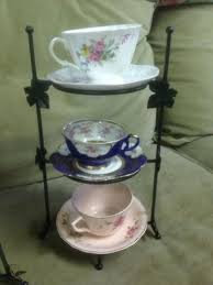 Tea cup and saucer display in wall shelves. Fantasy Cup And Saucer Display