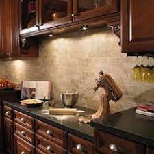 Classic cherry cabinets with black glaze and granite countertop in tan brown. Cherry Cabinets Cream Tile Backsplash Dark Countertops Love The Hardware Cherry Cabinets Kitchen Kitchen Design Dark Wood Kitchen Cabinets