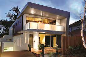 Contrasting exterior colors make the natural wood accents pop on this modern craftsman home plan, exclusive to architectural designs. 3 Storey Modern House With Timeless Design