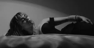 I give 'she is coming' by miley cyrus a fair 01/10 in the album review category. Miley Cyrus Tries To Gross Sex It Up For New Album But It S Not Working She Is Coming Opened With Just 15k Sold Including Streaming Singles Are Duds Showbiz411