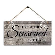 Jun 06, 2019 · from the oversized farmhouse sink and dusty blue cabinets to the exposed ceiling beams and animal wall art, this kitchen's rustic vibe is complemented by an earthy palette of reds and browns. Farmhouse Kitchen Decor Rustic Kitchen Signs Wall Decor Printed Wood Wall Art This Kitchen Is Seasoned With Love Kitchen Wall Decor 11 5 X 6 Pricepulse