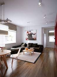 The subtle interior design of this room with the stunning wooden cabinet, chandelier displays breathable comfort and is so fulfilling that it would make you forget the world outside. Modern Red Apartment For A Young Couple Visualized Living Room Decor Apartment Living Room Decor Neutral Small Living Rooms