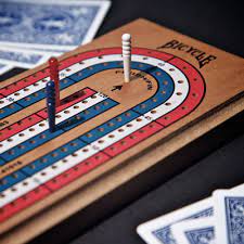 The two players are dealt five cards each, two of which are discarded into the crib. How To Play Cribbage How To Play Bicycle Playing Cards