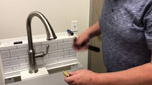 Pull out the spout and clamp the hose to prevent it from retracting. Quick Answer How Do You Remove A Flow Restrictor From A Kitchen Faucet Kitchen