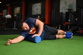 Latisimus Dorsi Stretch For Right Side Of The Body Lie On Your Side And Place A Foam Roller On The Latisimus Dorsi On Get In Shape Tired Muscles Sore Muscles