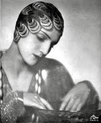 Arletty (French actress, singer and model) modeling for Schiaparelli and  photographed by Madame d'Ora in Paris circa 1930.