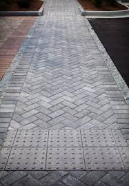 This dynamic design suggests energy and activity. 4x8 Herringbone Crosswalk Concrete Walkway Brick And Concrete Walkway Walkway Design