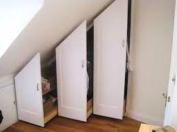 Buy quality cabinet, cupboard and wardrode units made in uk for a sloped ceilings. Under Eaves Pull Out Wardrobe Storage Bedford Park Chiswick Attic Bedroom Storage Attic Storage Solutions Attic Wardrobe