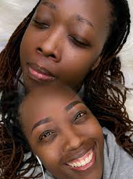 Off white or cream soft and comfortable office chair with footrest and  reclining ability.