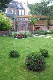 The Garden After The Planting Box Balls Lawn Contemporary Garden Design Outer Space Contemporary Garden Design Contemporary Garden Garden Design