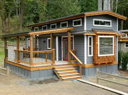 This design offers on bedroom, open great room, and covered front porch. The Wildwood Cottage 400 Sq Ft Tiny House Town