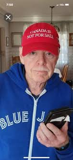 Canadian apologizes for wearing dodgers cap