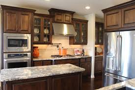 Natural stain knotty alder cabinets are the way to go. Burrows Cabinets Kitchen In Stained Knotty Alder And Mullion Doors With Glass