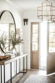 An intersecting steel base adds modern flair to the tufted cushion top. 450 Entryways Ideas House Design Home Interior