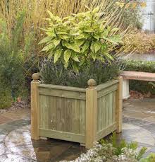 A traveler through the twentieth century, this stone trou. Versailles Planter Square Wooden Planter Taylor Made