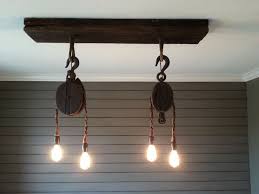 Custom Light Fixture From Vintage Pulleys Ceiling Plate From Reclaimed Wood Www Facebook Com Thetealbutt Custom Light Fixtures Light Fixtures Ceiling Lights