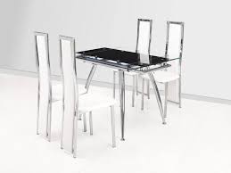 A dining table is where you enjoy a cup of coffee first thing in the morning spread out homework for the next day and where you gather the family for a warm meal to catch up with each other's lives. Small Black Extending Glass Dining Table And 4 White Chairs