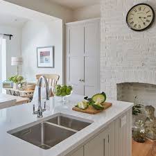 Statement island and hidden storage solutions in this modern shaker kitchen. Enjoy This Grey Shaker Kitchen Makeover Centred Around A Dining Table