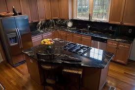 Gray shaker cabinets with wood kitchen island countertop. Island Black Granite Kitchen Outdoor Kitchen Countertops Kitchen Countertops
