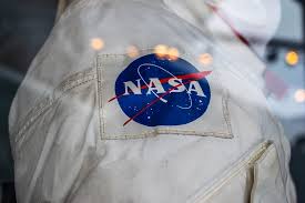 Though there was one more logo, not that famous. Hd Wallpaper Nasa Uniform Apparel Clothing Usa Los Angeles Symbol Logo Wallpaper Flare