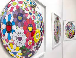 If your taste in interior decorating is a bit more black and white, this plush is for you. Kumi Contemporary Showcasing Takashi Murakami Flower Ball Prints In London Widewalls
