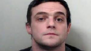 Stretford man wanted over handgun found in garden