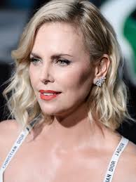 Charlize Theron rocks white Dior bra, mini skirt at 'Atomic Blonde' premiere