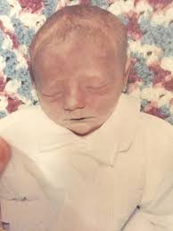 Could someone please make an image of Jesus holding a tiny (premature)  Afro-American (biracial) baby in his hands? I've seen the image here before  but have searched and looked through the Albums