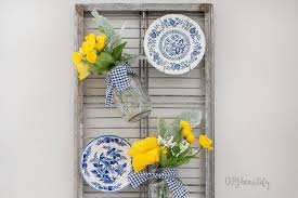 You'll just need strips of shredded and twisted fabric as well as hot glue and your jars. Hanging Mason Jar Flower Display Diy Beautify Creating Beauty At Home