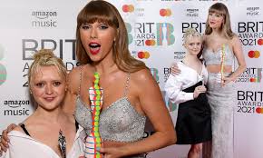 Olivia rodrigo and taylor swift. Brit Awards 2021 Taylor Swift Looks Radiant As She Poses Alongside Newly Blonde Maisie Williams Daily Mail Online