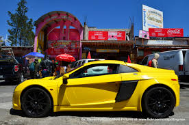 yellow car in black rims yellow car cool cars car