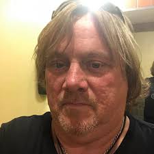 What is the purpose of a criss-cross stack of corrugated pipes wrapped in  plastic netting in a lake?