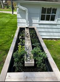 The Easiest Way To Water Your Garden Backyard Landscaping Gutter Garden Outdoor Gardens