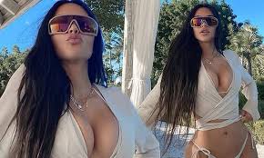 2 years ago 1 21:47. Kim Kardashian Shares A Busty Snap In A Plunging Top And Thong Bikini Daily Mail Online