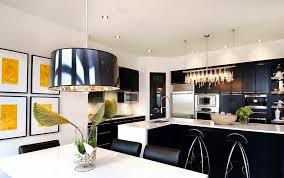 The green trim around the conveniently placed kitchen window and matching decor, dishes, and extra pops of color add a touch of contemporary to an otherwise simple kitchen. Black And White Kitchen Ideas Home Decor Ideas