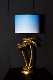 Maybe you would like to learn more about one of these? Antique Gold Palm Tree Table Lamp With Blue White Shade