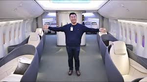 The seat has an entertainment screen that folds out. Inside The Newest Boeing 747 Boeing Customer Experience Center Youtube