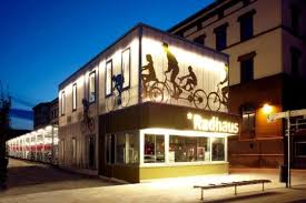 Radhaus Is A Glowing Bike Shop Storage Facility In Eastern Germany Bike Storage Shop Facade Modern Greenhouses