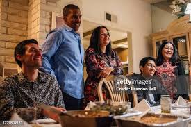 Jennifer Collis makes Thanksgiving dinner while talking with family... News  Photo